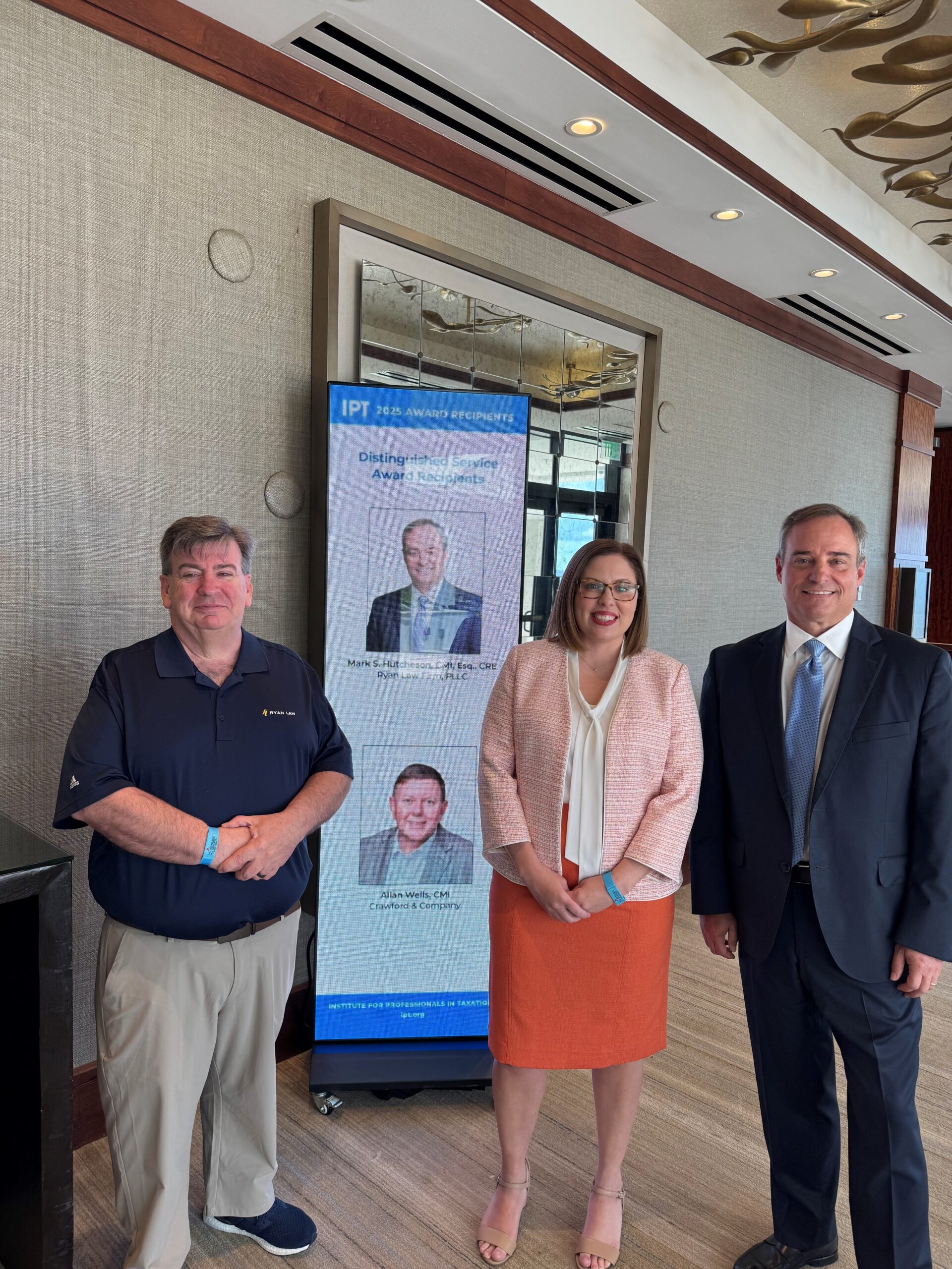 Mark Hutcheson posing with his team at the IPT Conference in Florida 2025